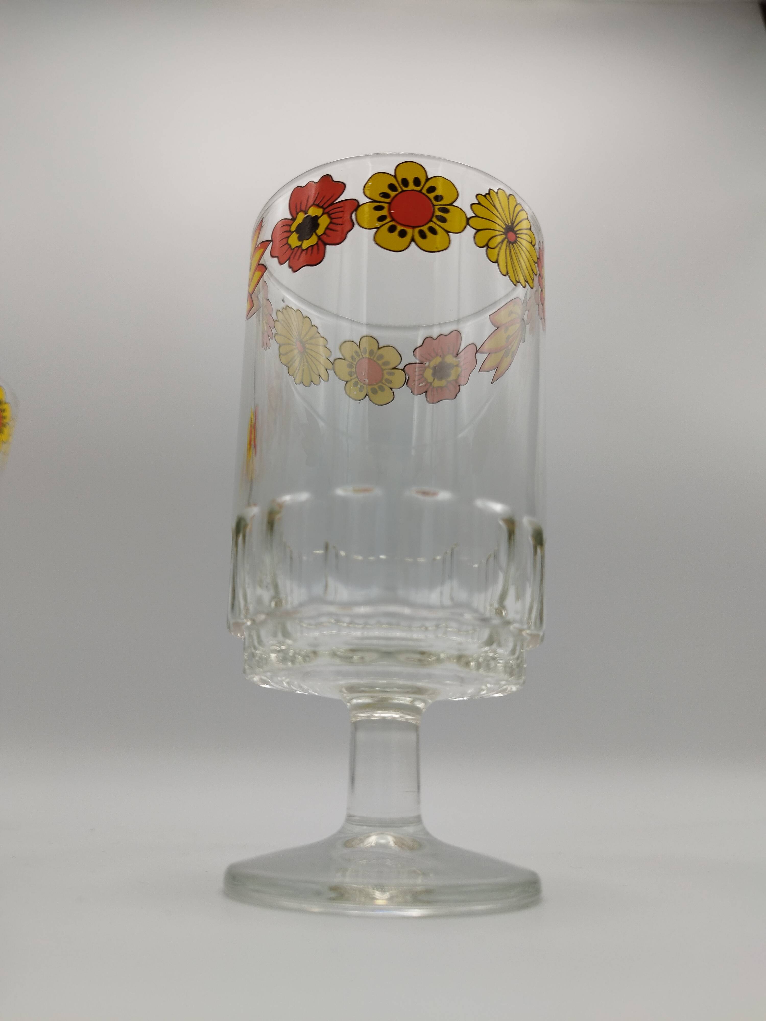 Vintage stemmed glass with floral decoration