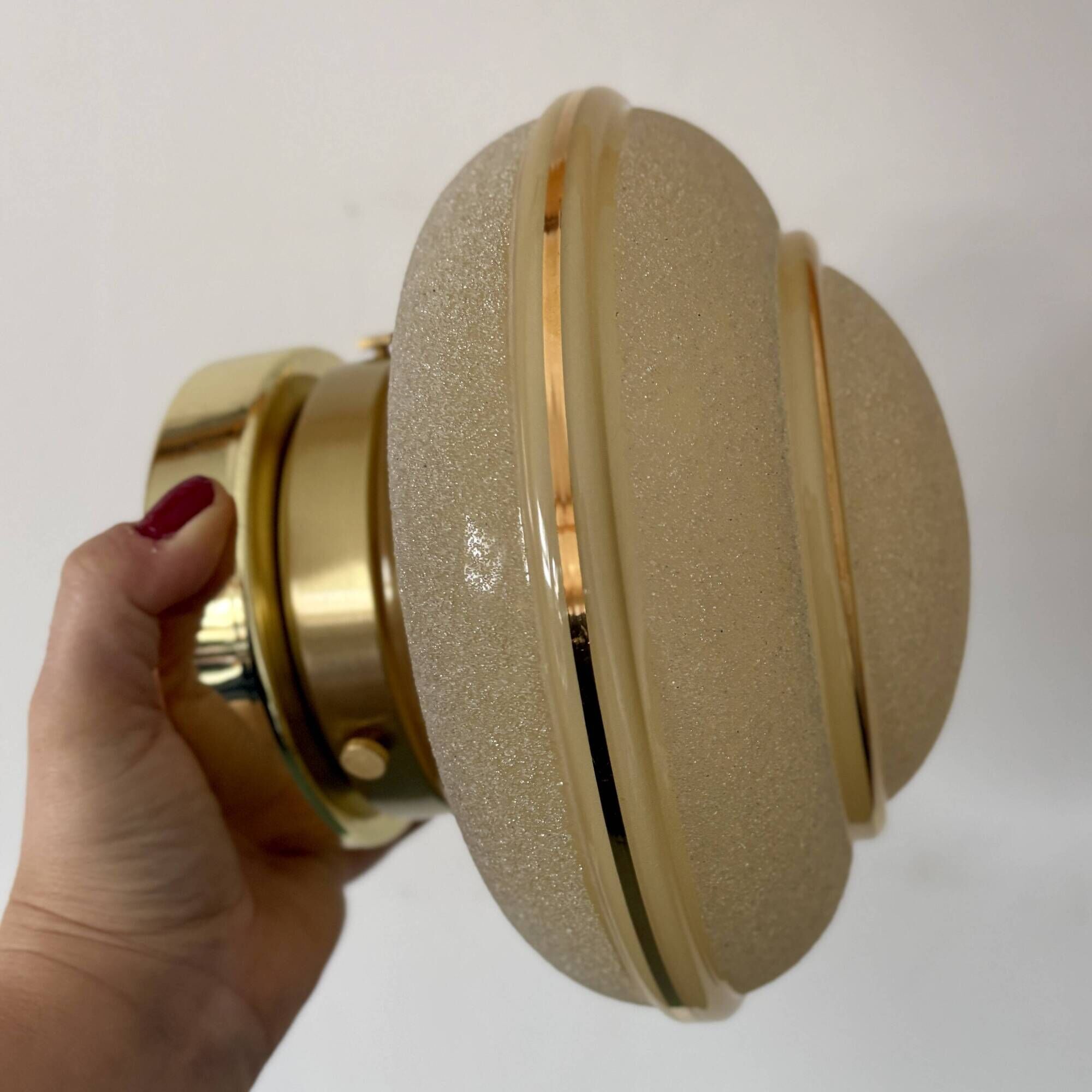 Vintage Art Deco globe wall/ceiling light in frosted yellow and gold glass.