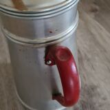 Old enamelled coffee maker in red handle aluminum
