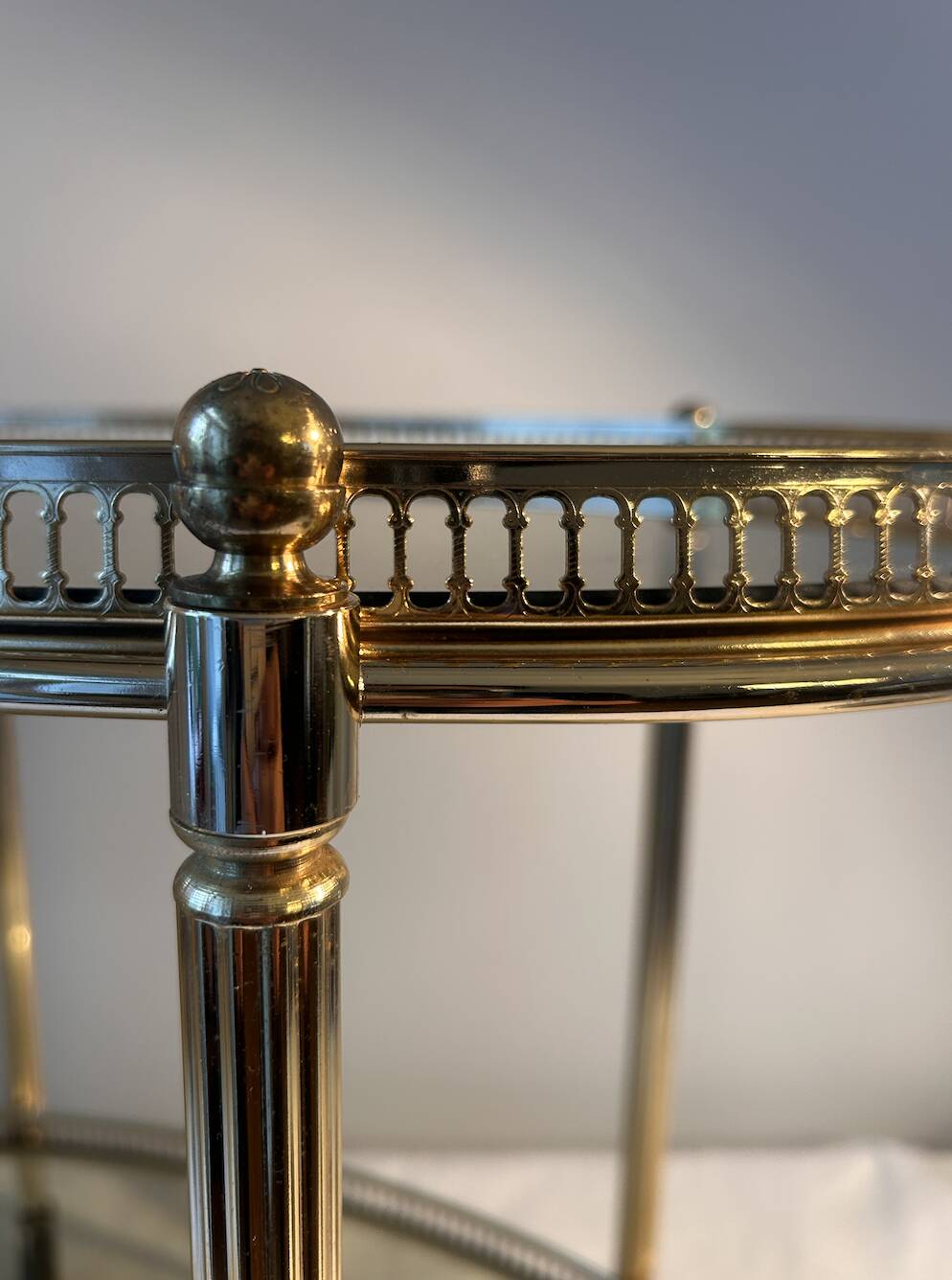 Neoclassical bar cart in gilded brass and smoked glass