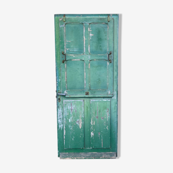 Old entrance door with shutter