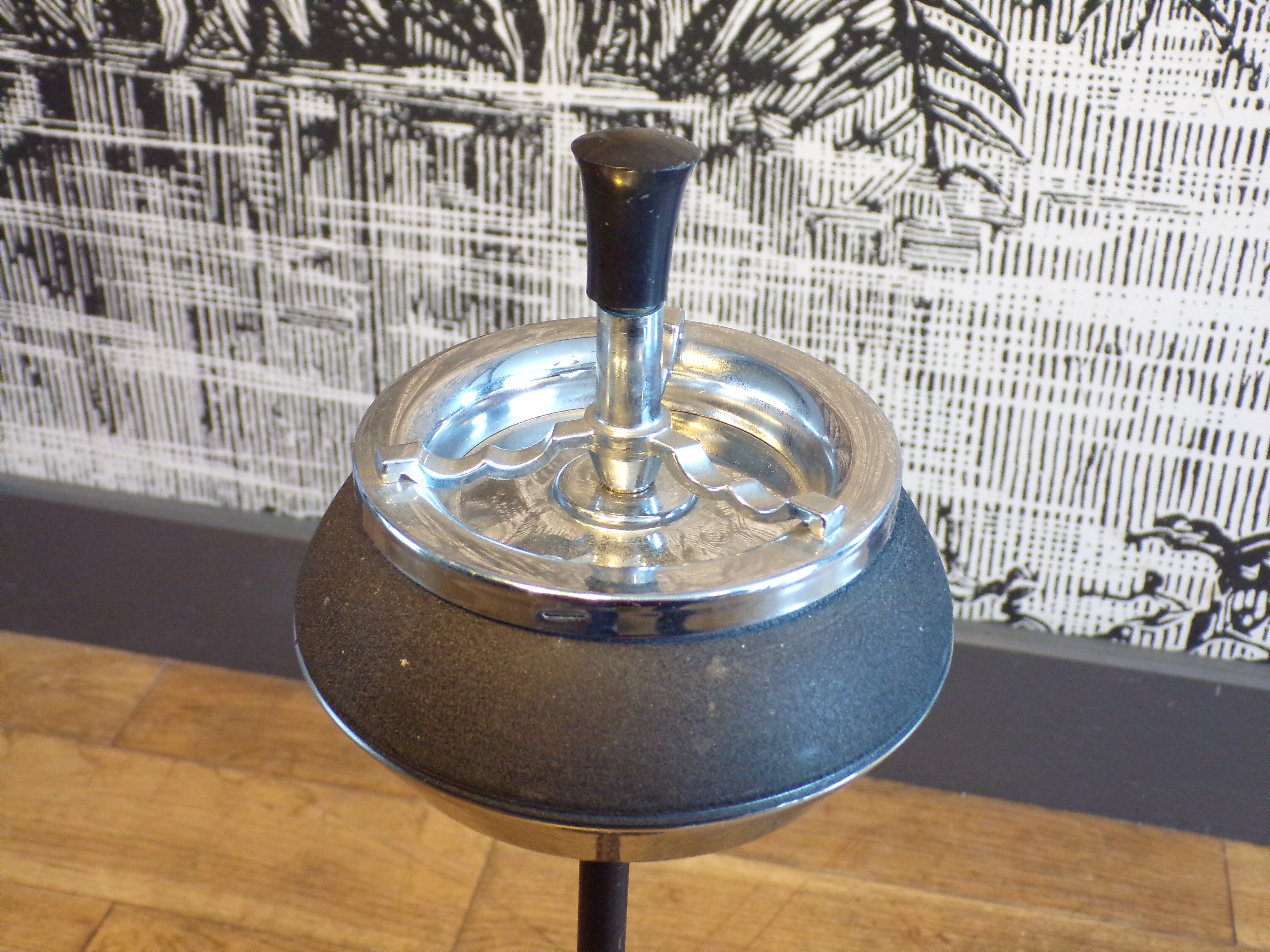 Vintage push-up ashtray on foot