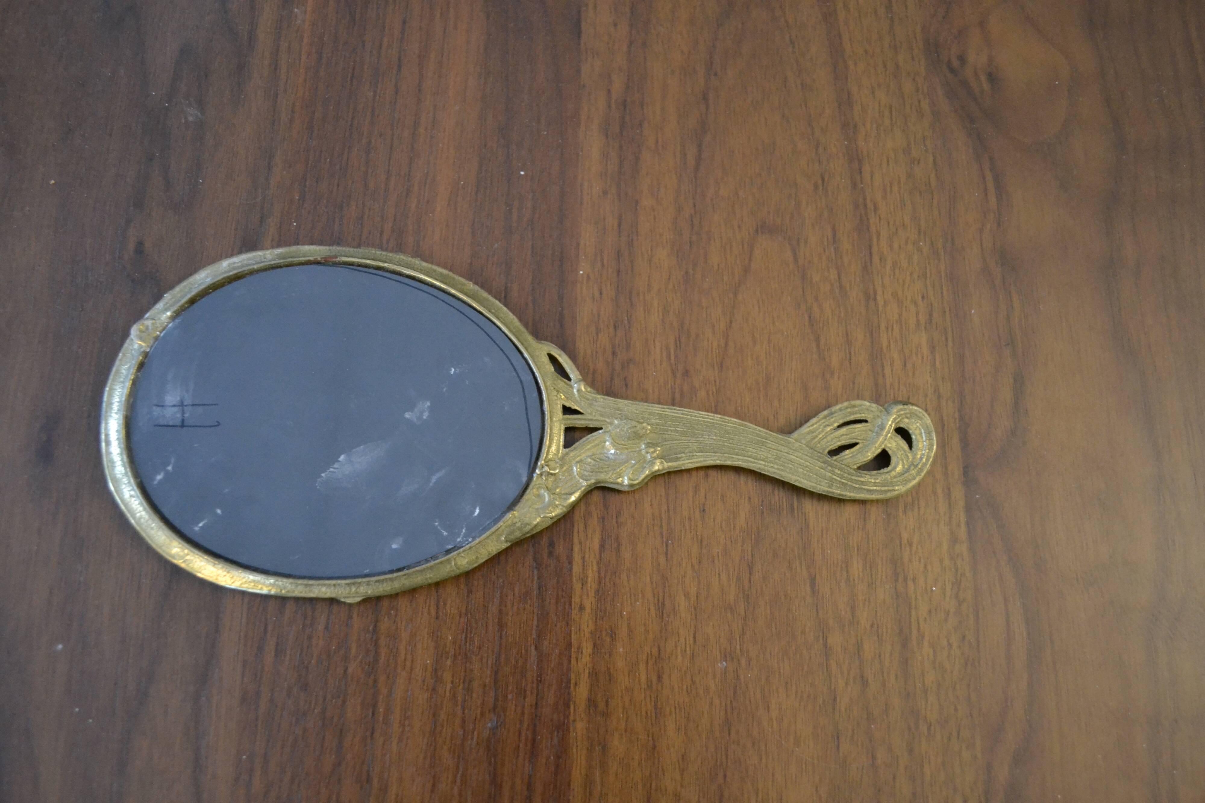 Brass hand "nymph" mirror