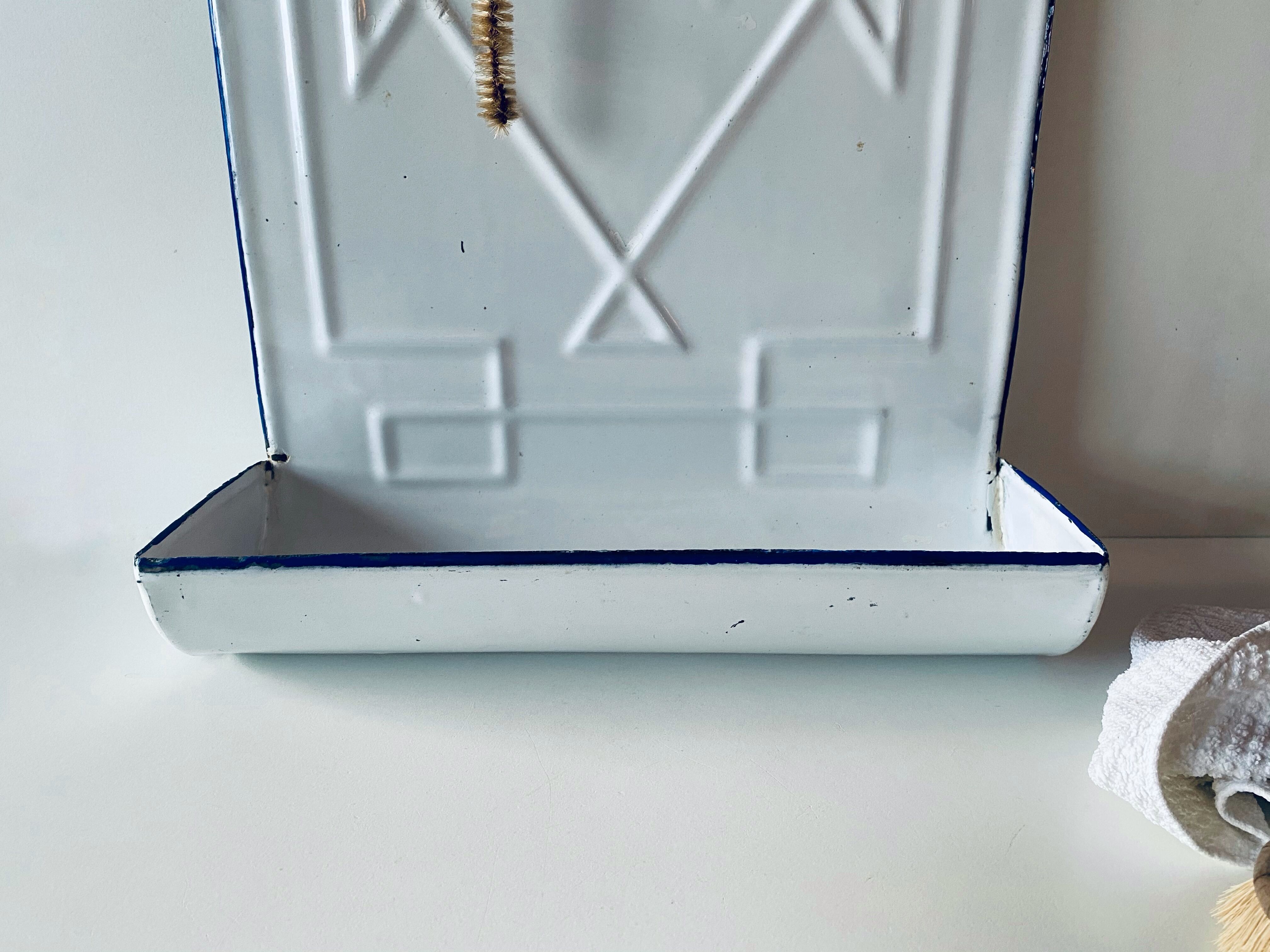 Old enamelled kitchen utensil display