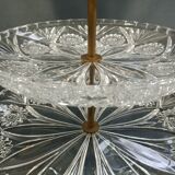 Three-storey display in chiseled glass and brass