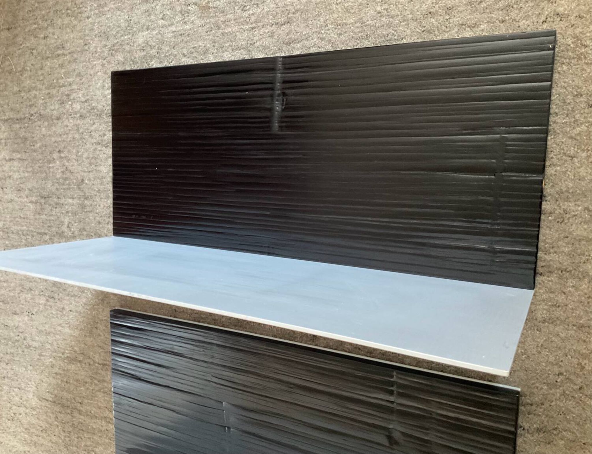 Pair of contemporary shelves in steel and stained wood