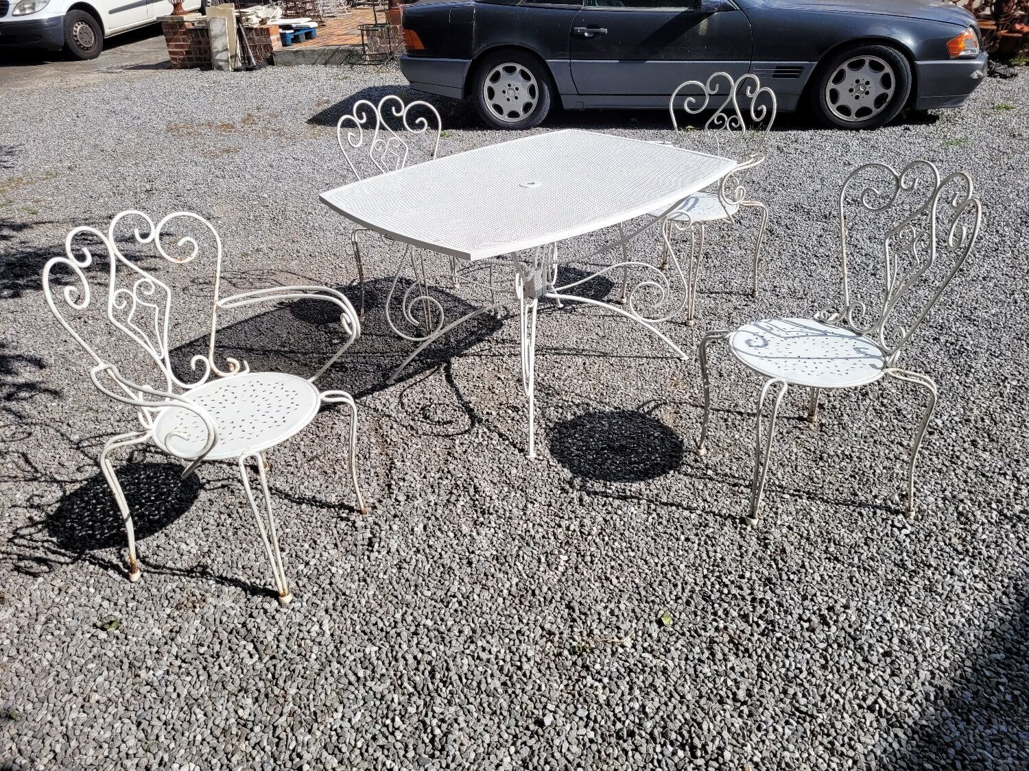Old wrought iron garden furniture, table + 2 armchairs + 2 chairs