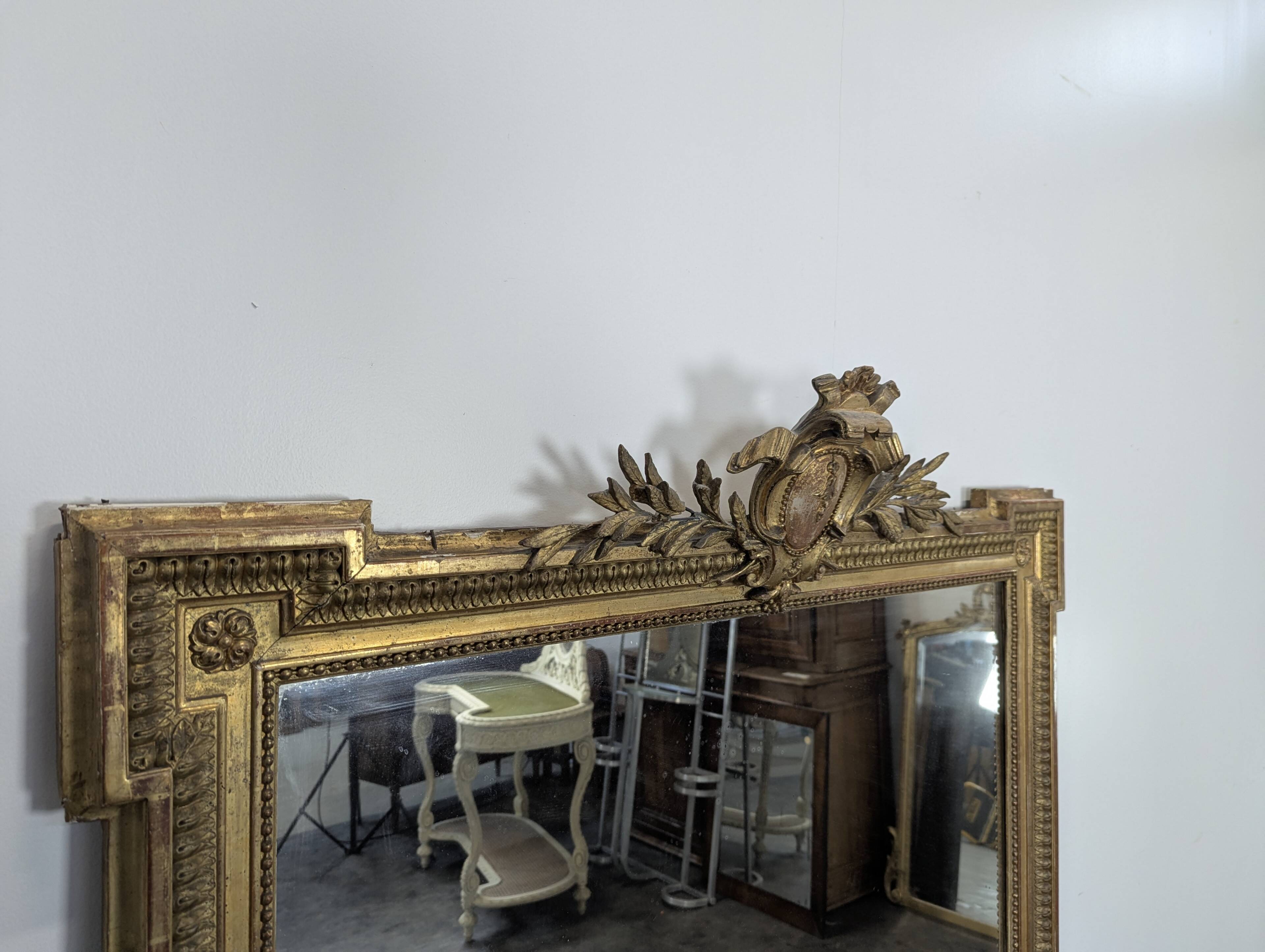 Large stucco and gilded wood mirror from the Napoléon III period.