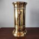 Vintage brass umbrella stand with lion decoration.