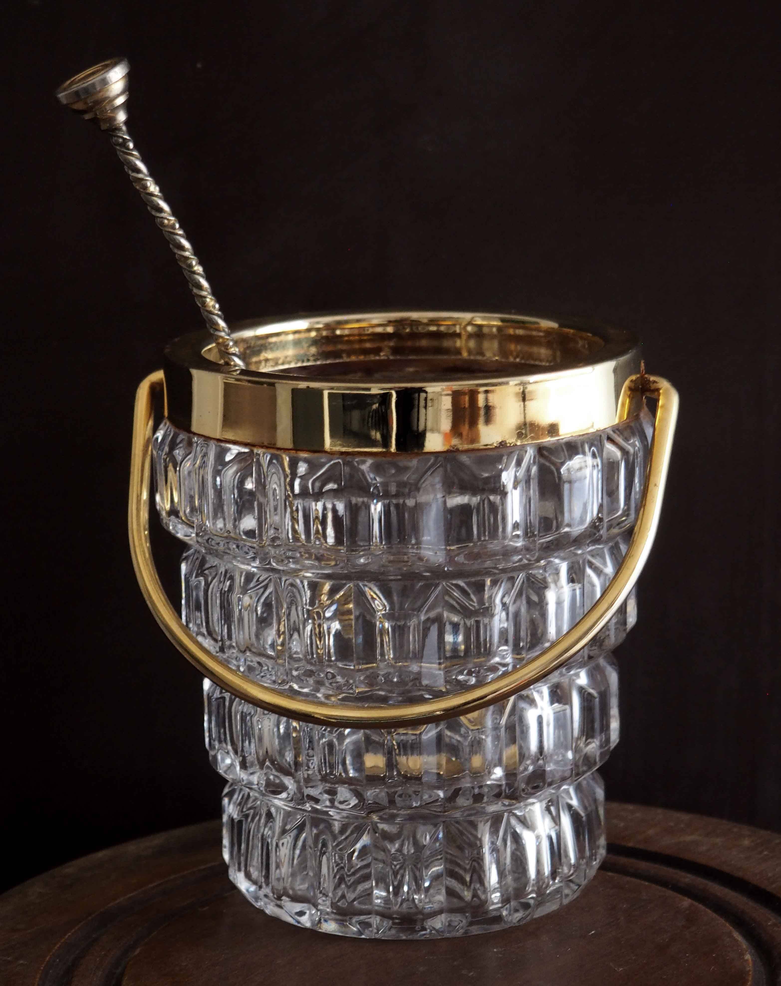 Crystal ice bucket and golden ladle