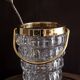 Crystal ice bucket and golden ladle