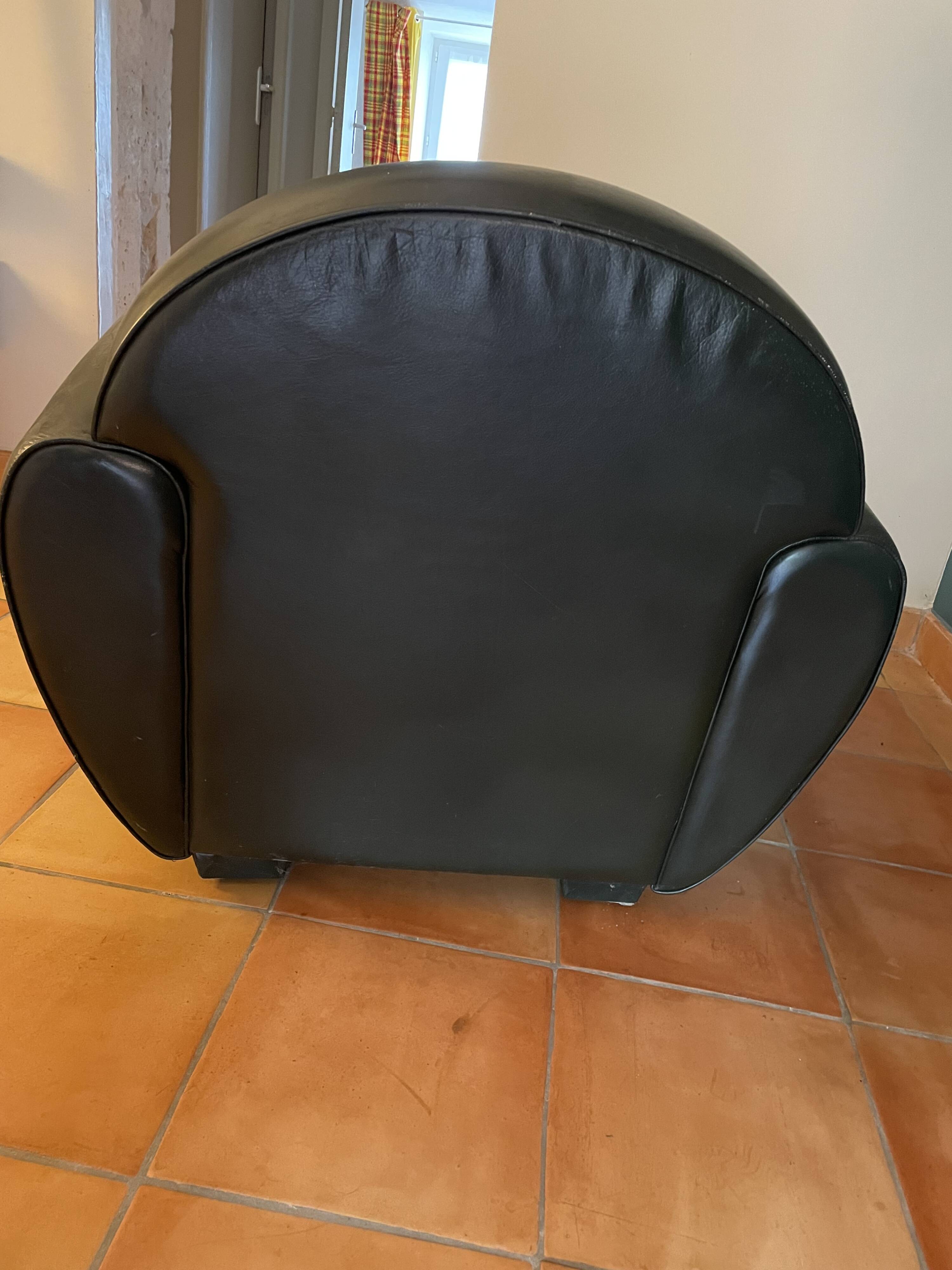 Green leather club chairs