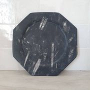 Decorative plate made of fossilised orthoceras marble.