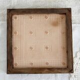 Vintage raspberry pattern earthenware and wood trivet