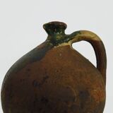Old goat, jug, gargoulette, water pitcher in glazed green sandstone. nineteenth century