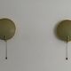 Pair of green plexiglass and gold metal wall lights by Erco, 1950s, Germany.