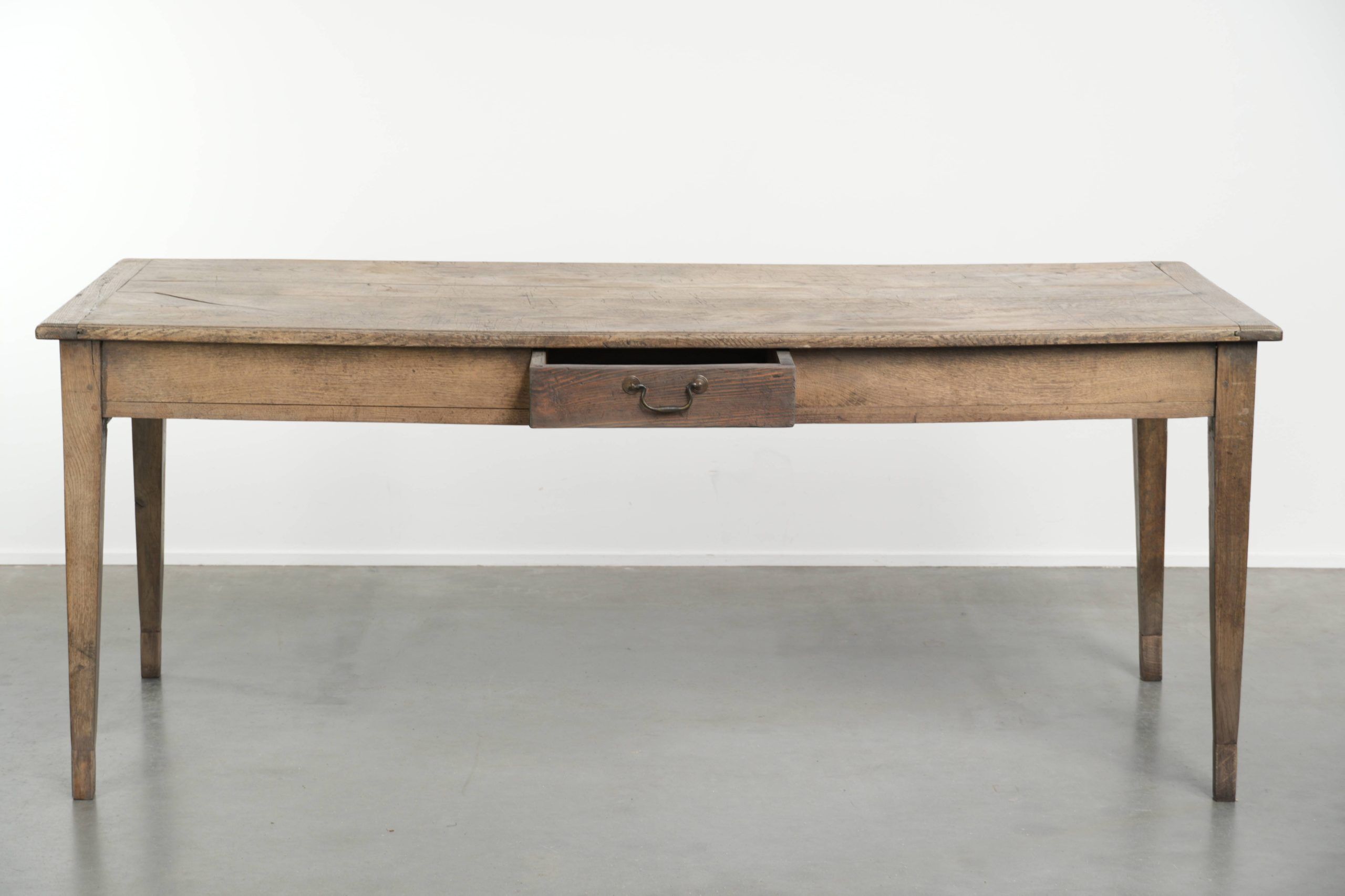Antique French oak dining table for 6 to 8 people with a baguette drawer