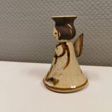 Ceramic candle holder, in the shape of an angel, signed at the bottom.