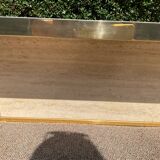 Vintage coffee table in travertine and brass.