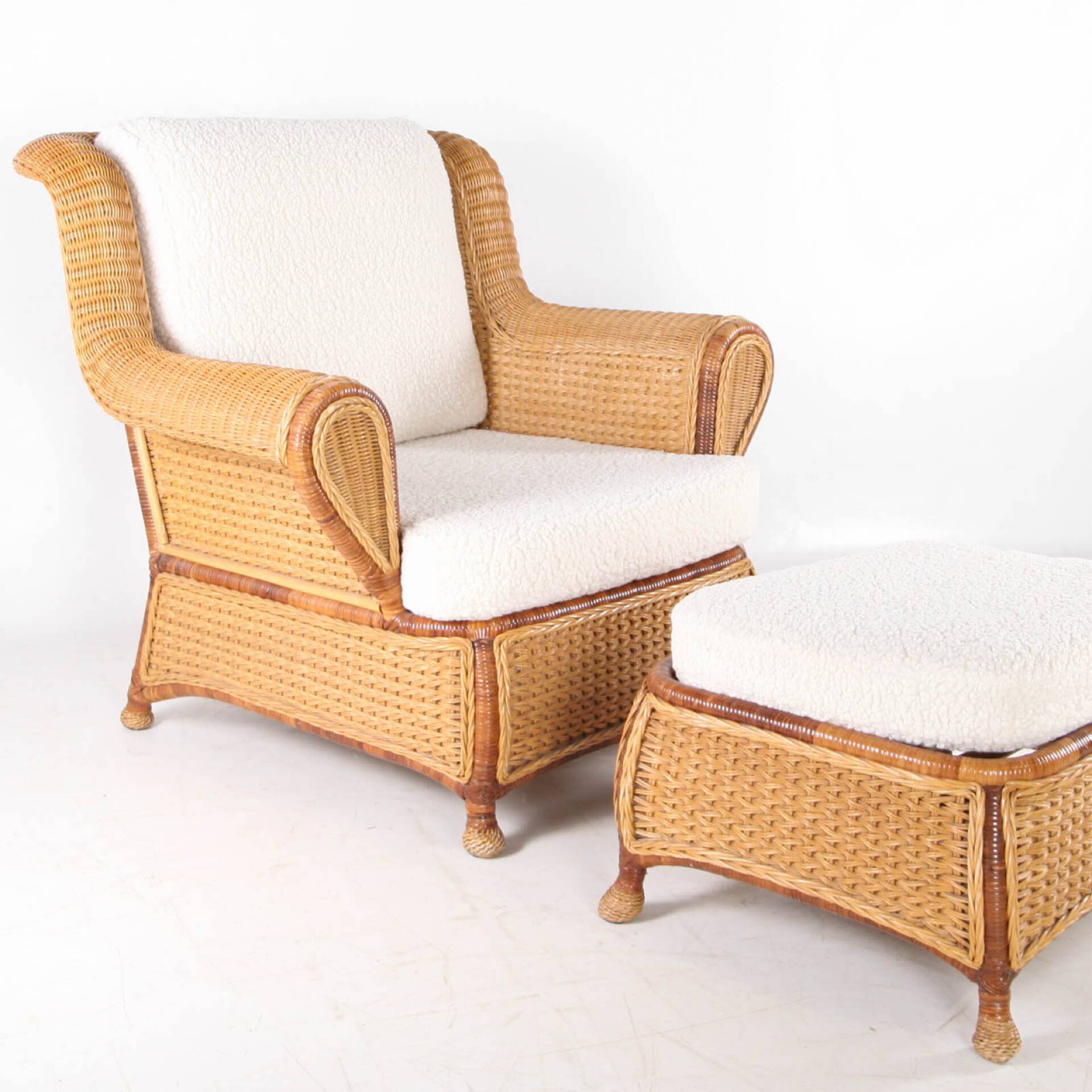 Large wicker armchair and its ottoman