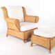 Large wicker armchair and its ottoman
