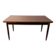 Rectangular extendable dining table with Scandinavian design in teak.