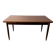 Rectangular extendable dining table with Scandinavian design in teak.