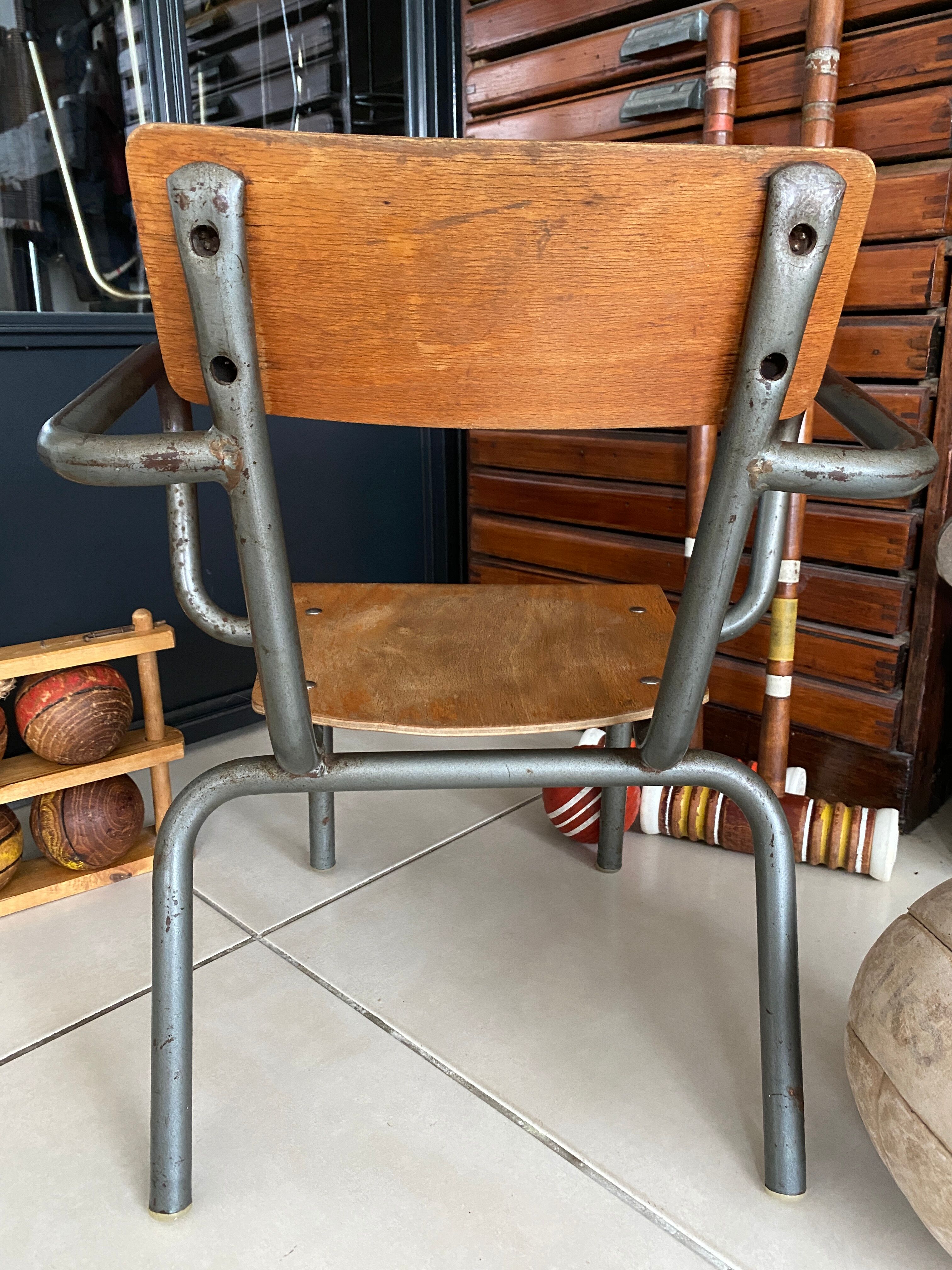 Old Mullca school chair with armrests