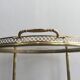 Round brass rolling table attributed to Maison Jansen