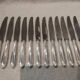 12 silver-plated metal table knives by Christofle Albatros, 24.7 cm.