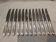 12 silver-plated metal table knives by Christofle Albatros, 24.7 cm.