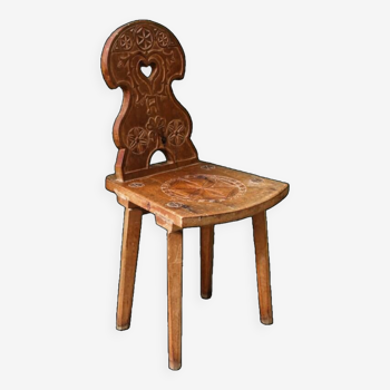 Old Swiss escabelle chair in carved wood