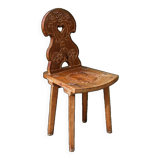 Old Swiss escabelle chair in carved wood