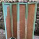 Wooden screen in Asian style, covered with Chinese wallpaper.