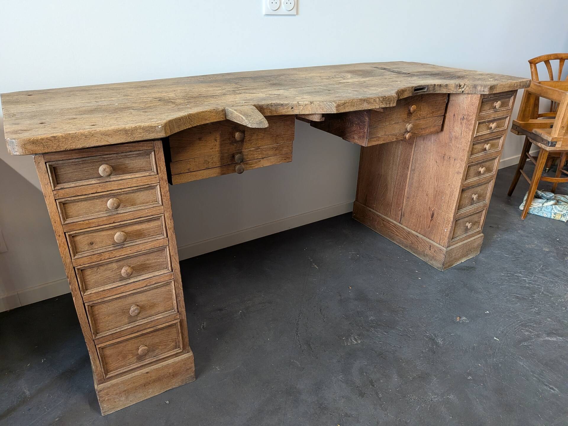 Double jeweller's workbench in solid oak, 18 drawers, early 20th century.