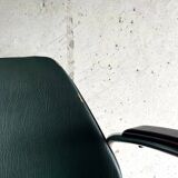 Vintage green faux leather and chrome armchair