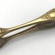 Sugar or ice cube tongs, gold star stamp with lion paw finish