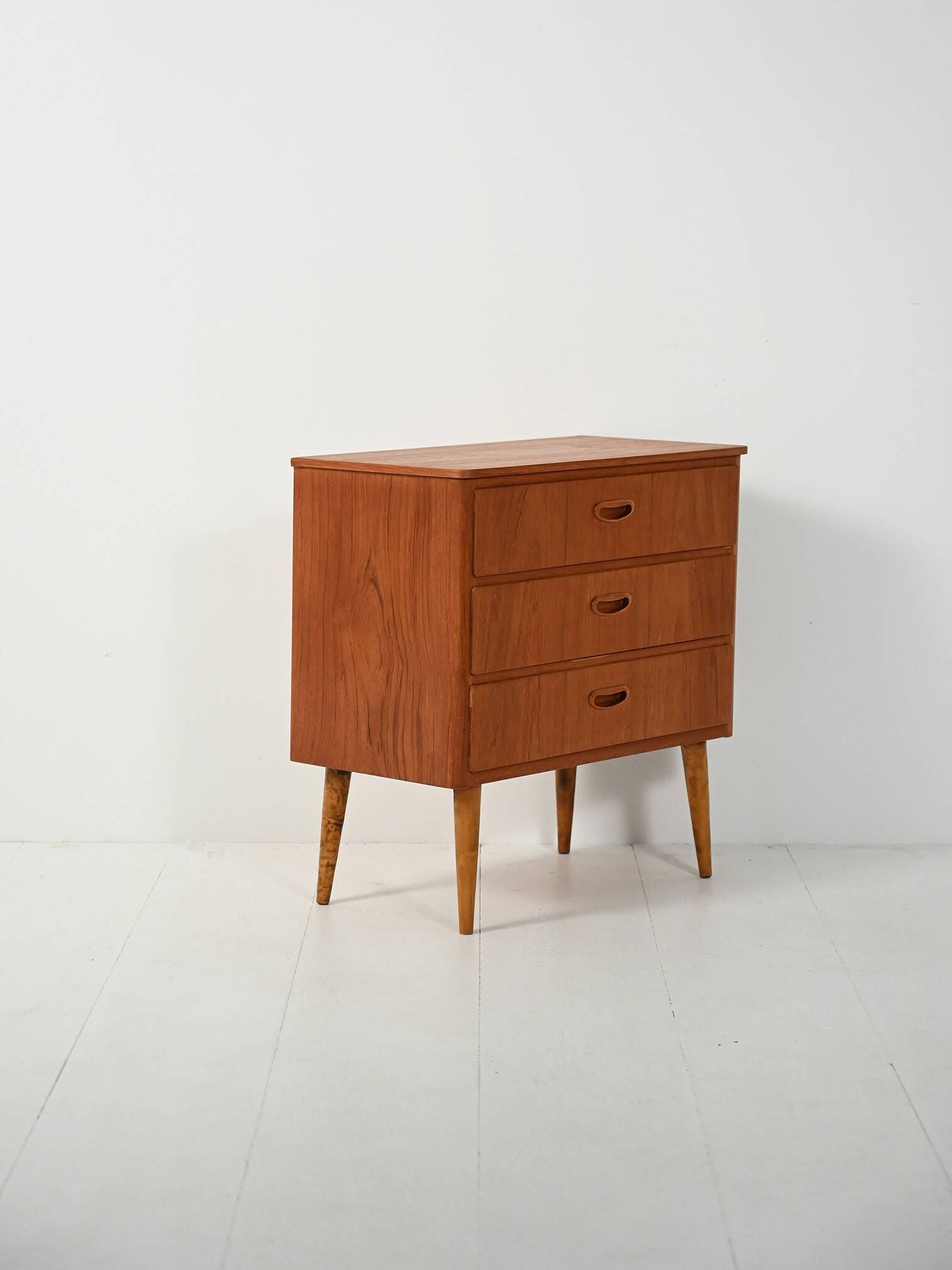 Scandinavian Chest of Drawers in teak with turned birch legs, 1950s