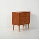 Scandinavian Chest of Drawers in teak with turned birch legs, 1950s