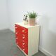 Vintage ladekast met rood roze kunststof lades 1970