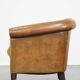 Fauteuil en cuir de mouton et clous de tapissier