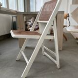 4 folding chairs with wicker seating