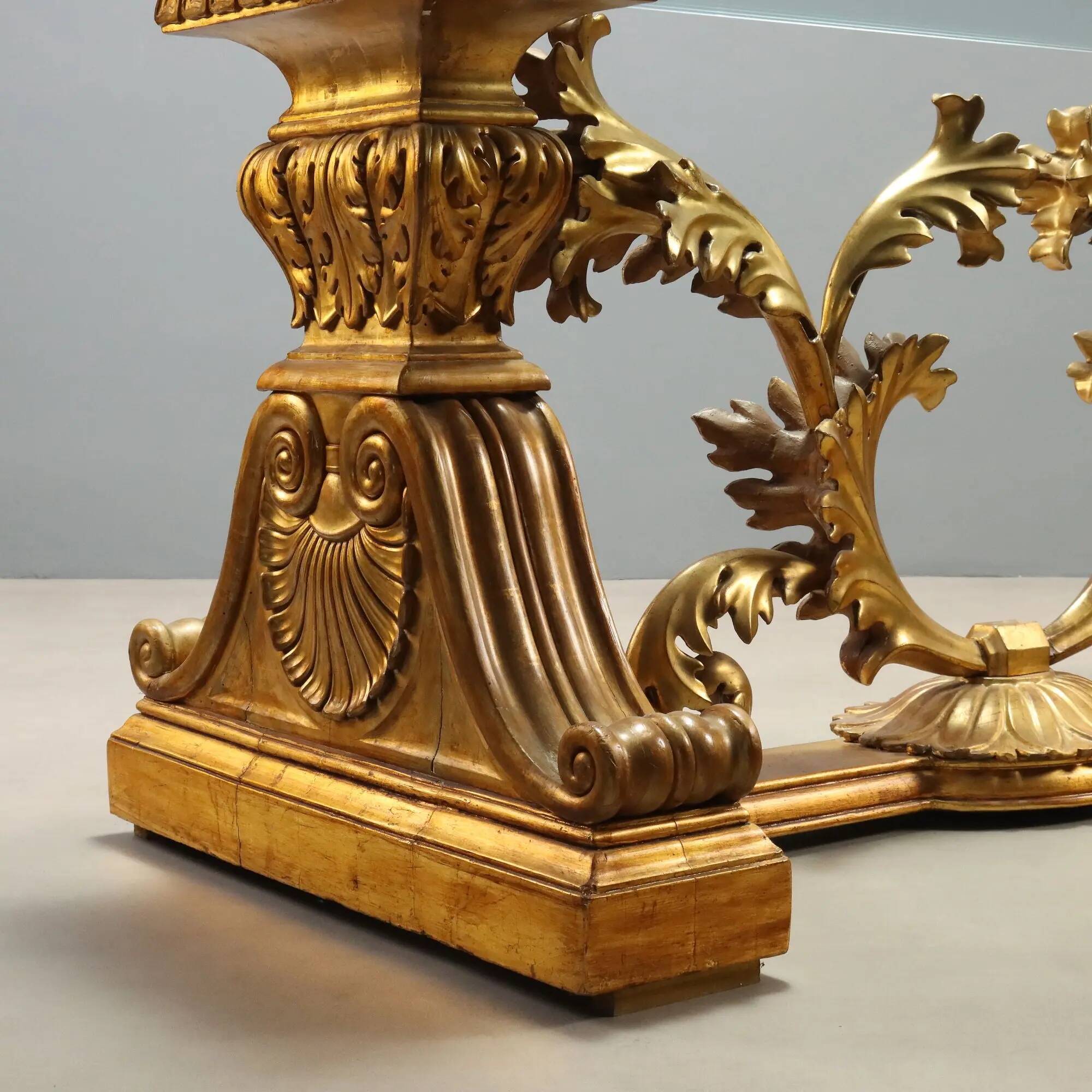 Antique coffee table in gilded wood with a glass top, Italy, 20th century.