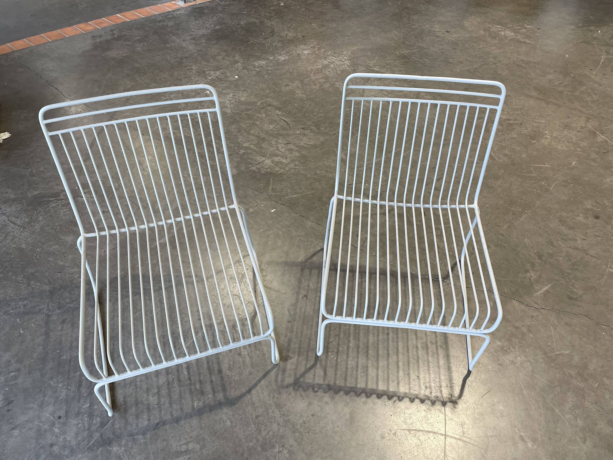 Many handcrafted wrought iron chairs