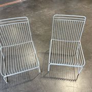Many handcrafted wrought iron chairs