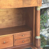 A small piece of Bonheur du jour with detached columns in Empire-era mahogany.