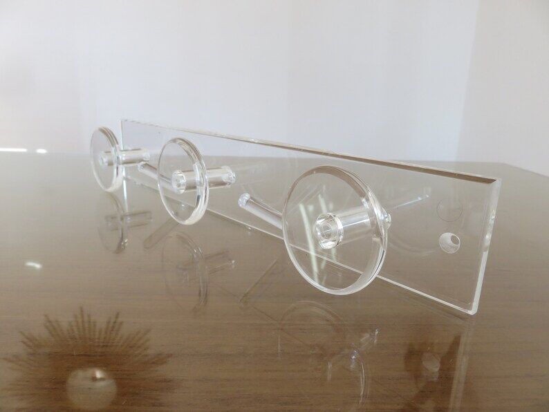 Wall coat rack in transparent plexiglass 3 hooks. 1980