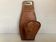 Leather coat hook in the style of Jacques Adnet