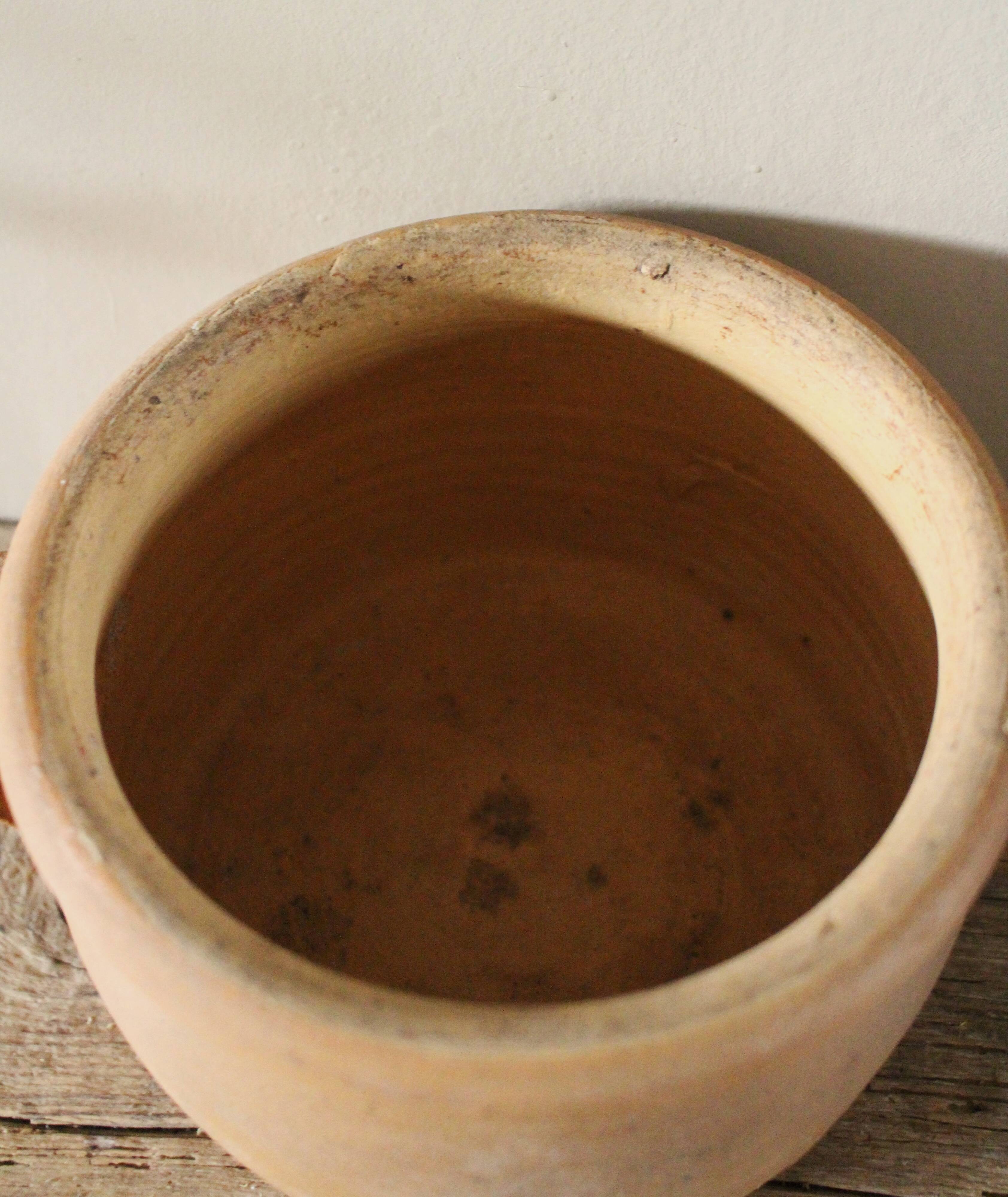 Round terracotta milk jug with handle