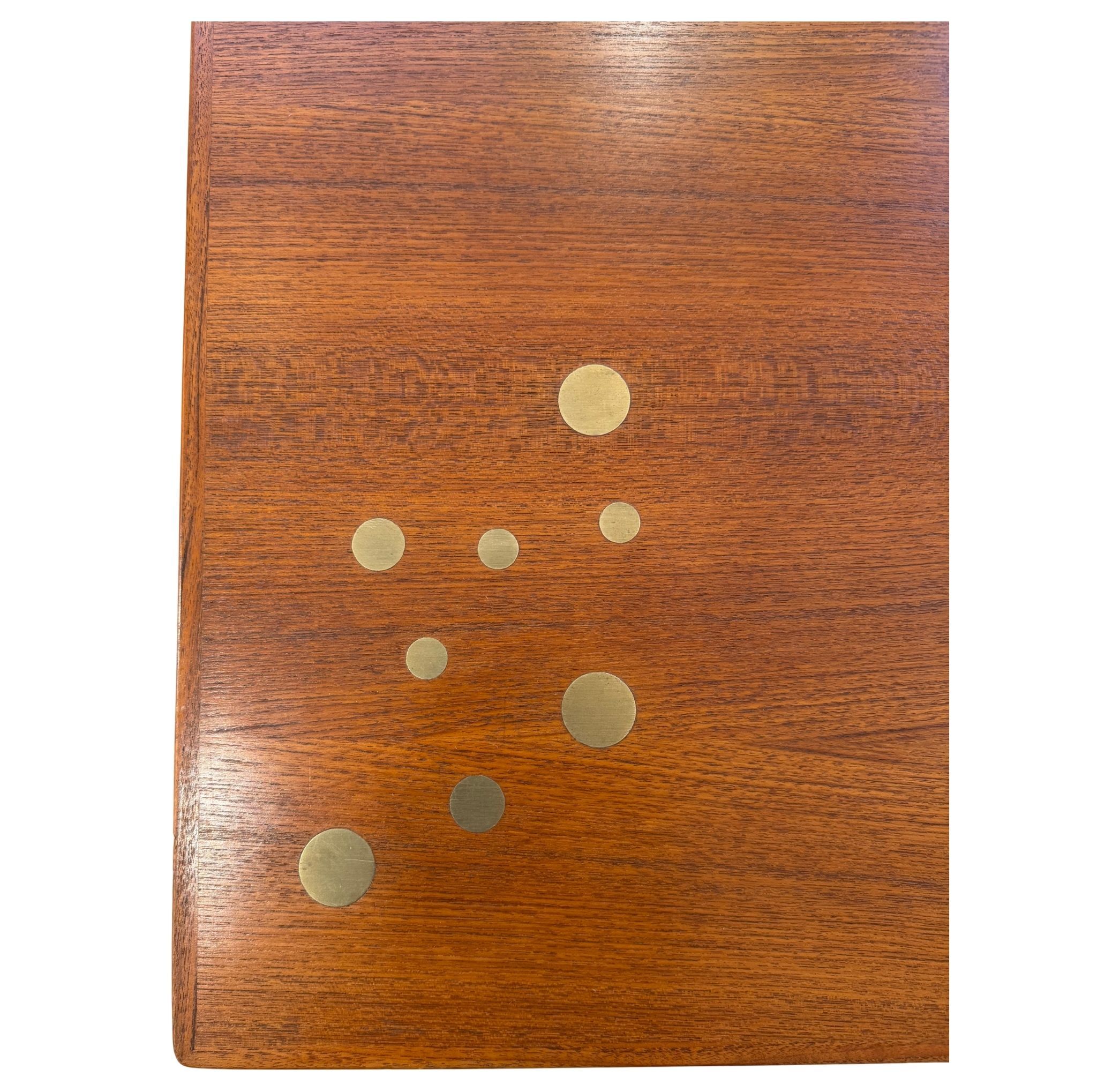 Scandinavian coffee table in teak and brass.